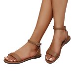 Tan leather-look Roman flat sandals with adjustable ankle strap