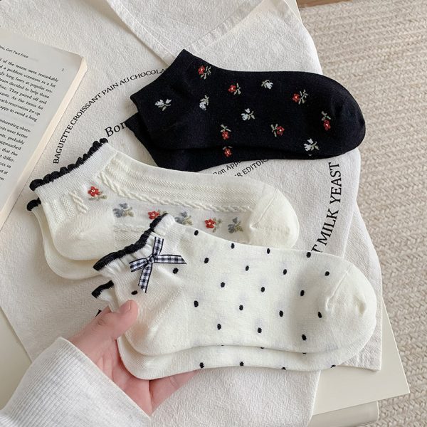 3-pair bundle of Kawaii animal ankle socks with 3D pom-pom accents.