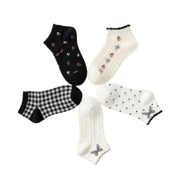 5-pair pack of Coquette ruffle ankle socks featuring floral prints, polka dots, gingham bows, and cottagecore styles.