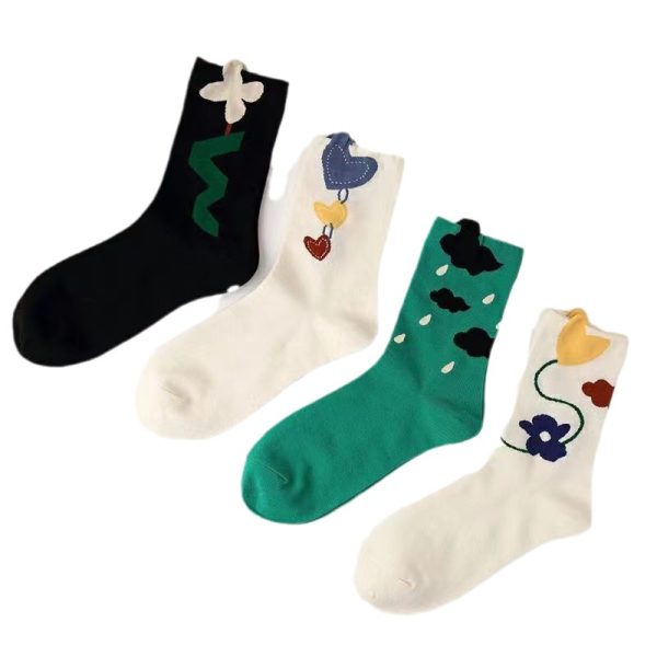 A 4-pair bundle of whimsical crew sock set featuring cartoon floral, heart, and cloud patterns.