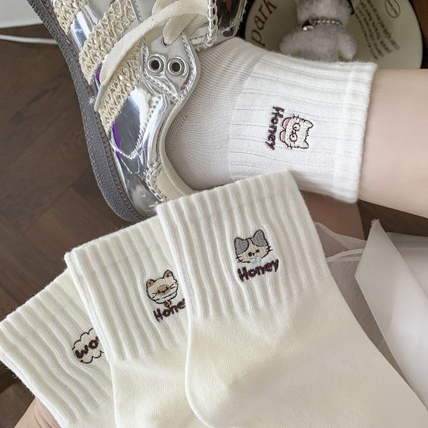 5-pair pack of white ribbed crew socks with cat and bow embroidery.