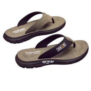 mens-grey-thick-soled-beach-flip-flops. A pair of grey GUANZUMEI branded flip-flops with black thick soles, featuring a detailed logo on the strap.